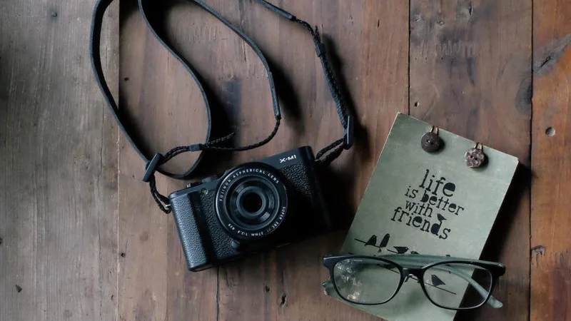 A vintage camera on a wooden table