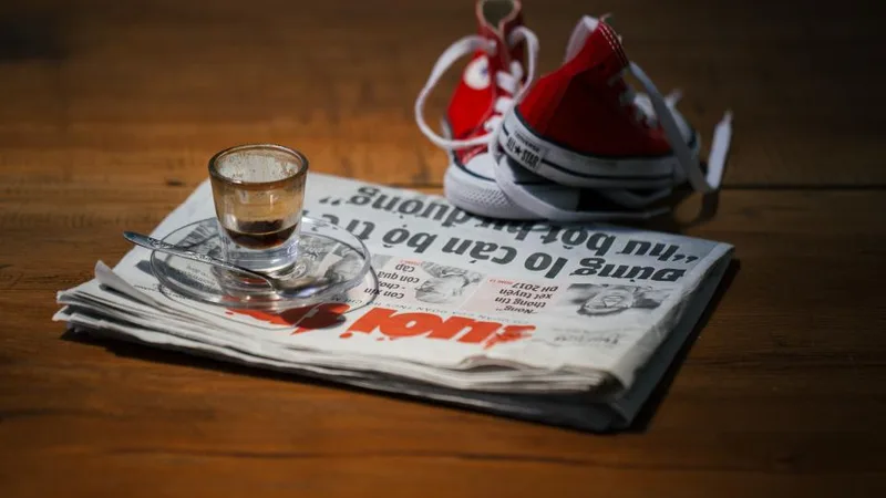 Newspaper and an espresso cup