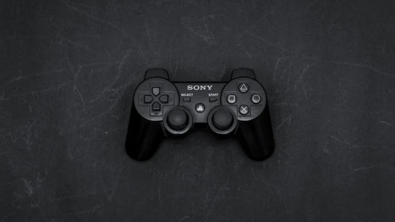 A game controller on a dark surface