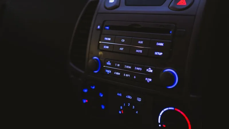 A car dashboard with the radio display