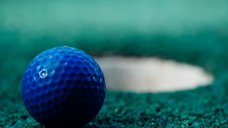 A golf ball near the hole