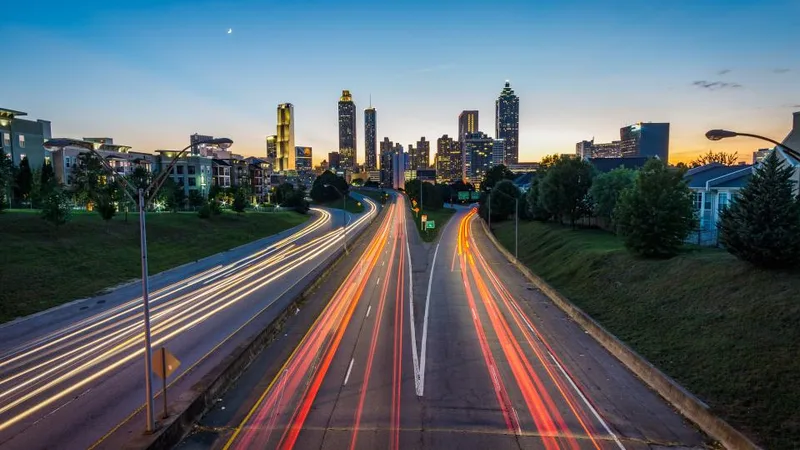 City road with light trails at dusk