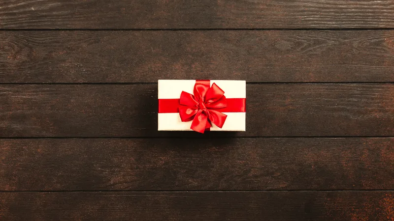 A small wrapped gift on a wooden table